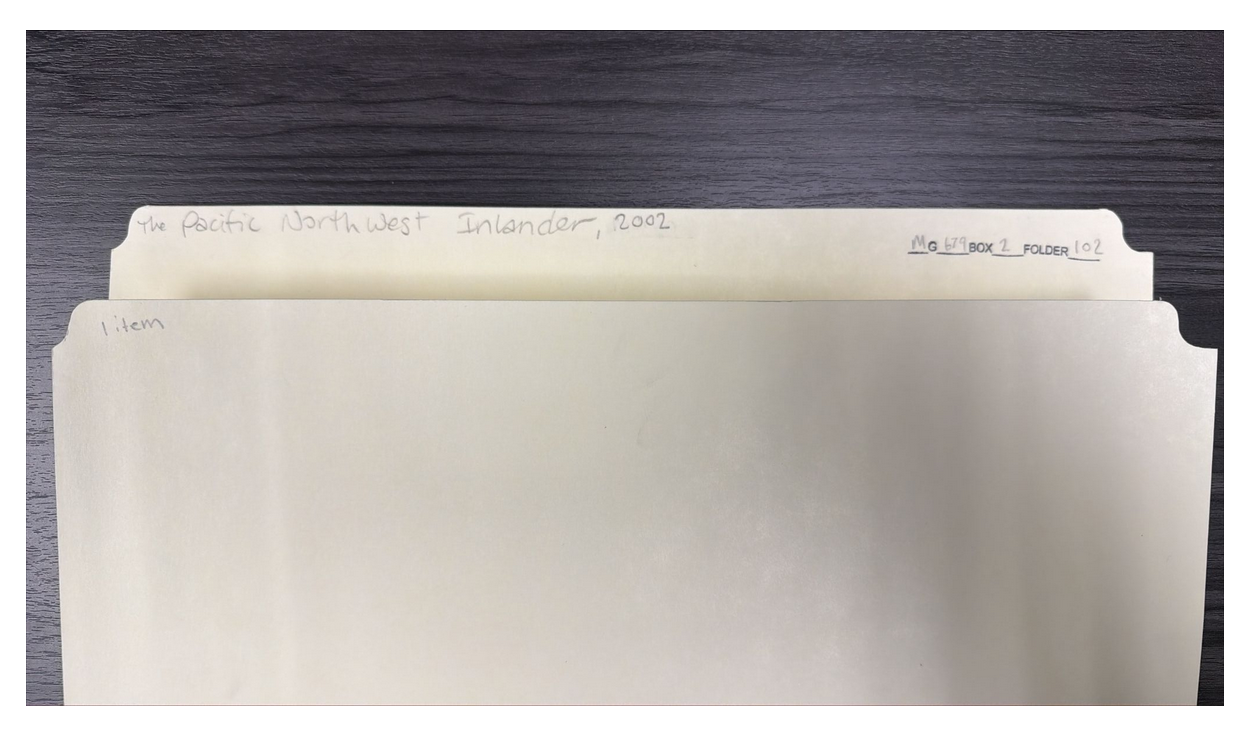 photograph of a folder with writing on it